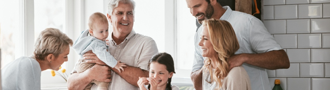 Three generations of family cooking in the kitchen