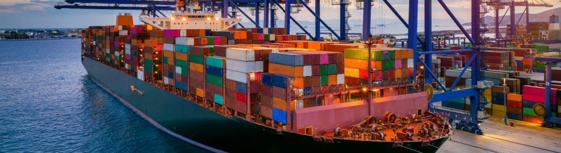 A container cargo ship at a commercial dock.