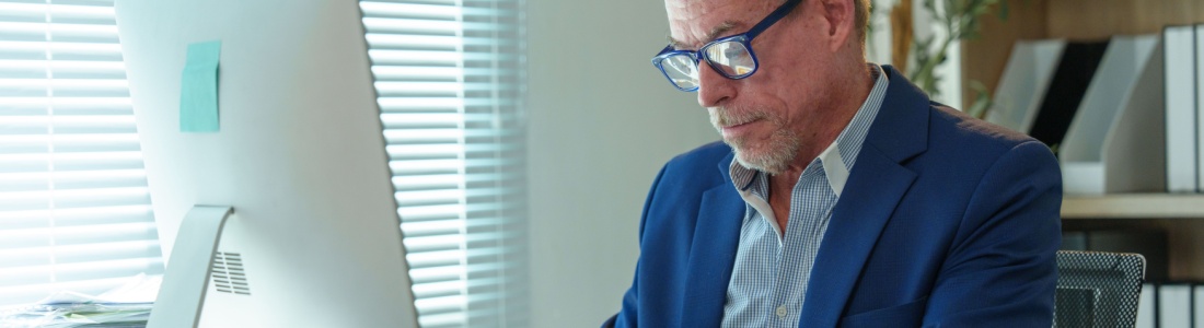 A man working at an office desk.