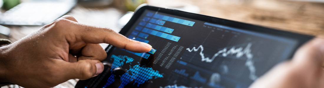 A person reviewing investment performance on a tablet.